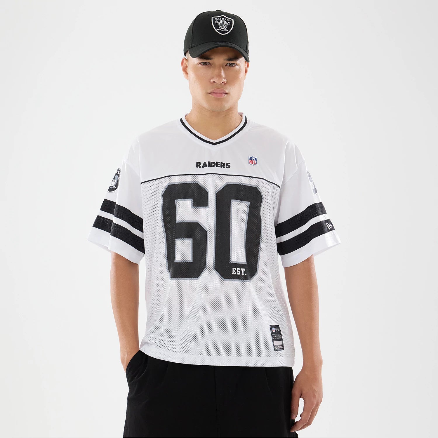 The model is wearing this NFL Las Vegas Raiders Mesh Jersey in white. 1