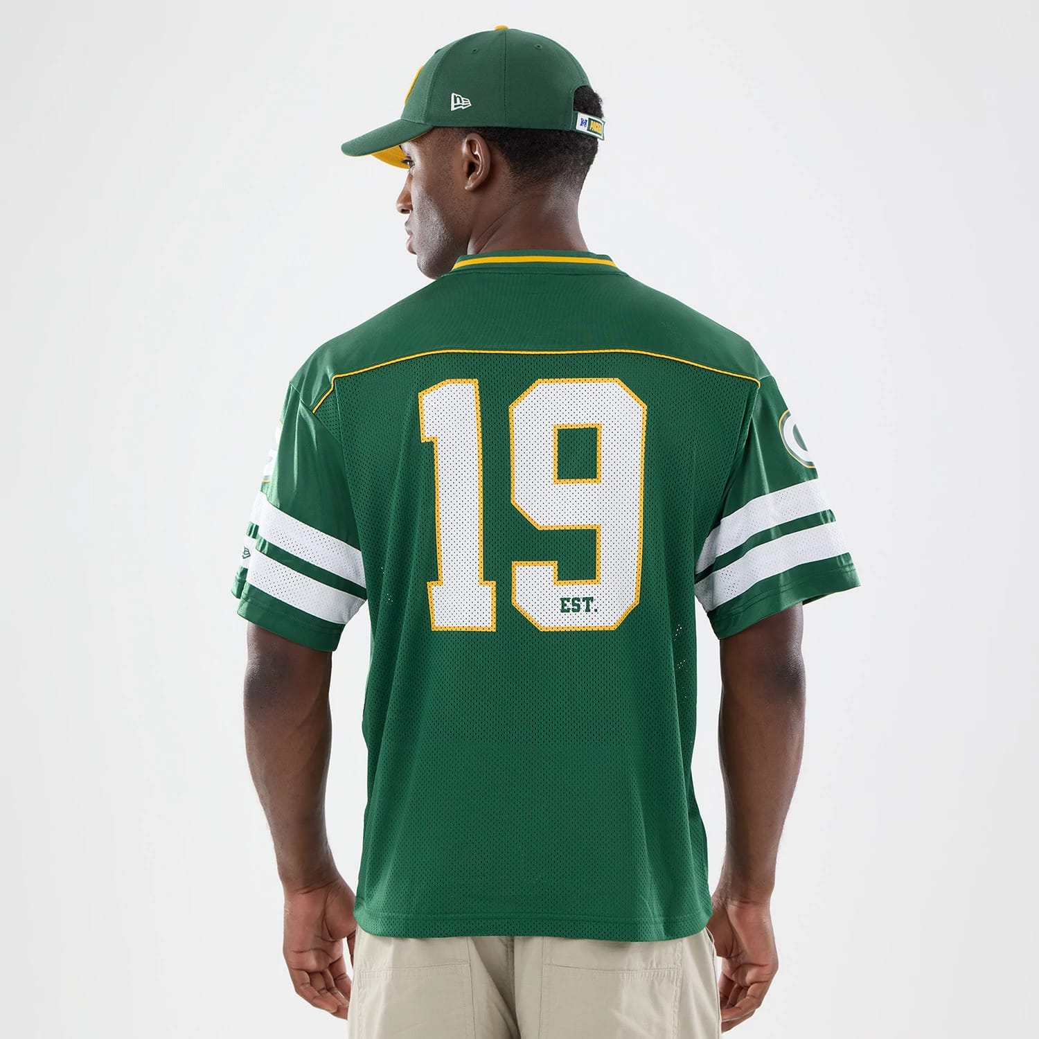 The model is wearing this NFL Green Bay Packers Mesh Jersey in green. 2