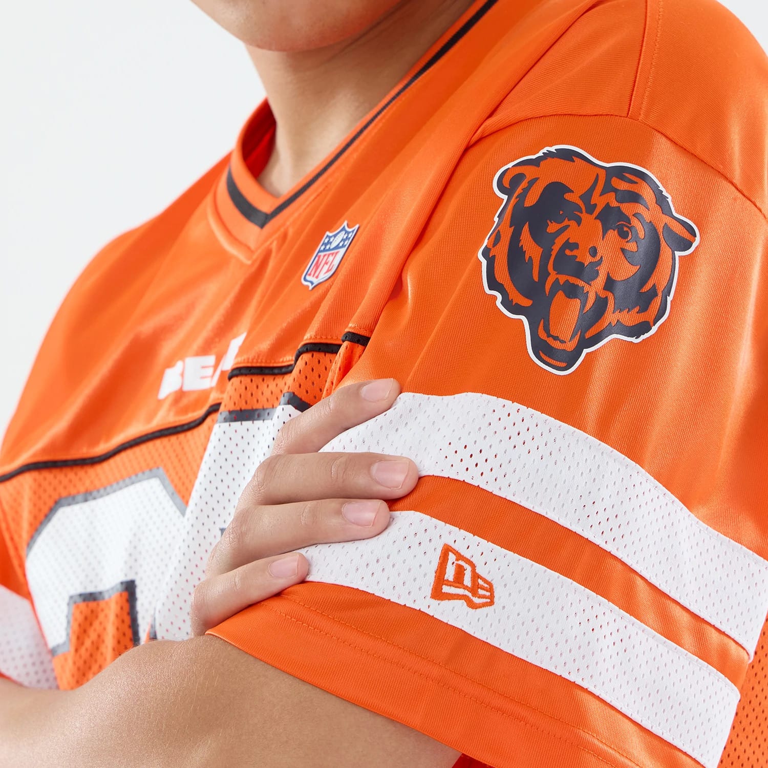 The model is wearing this NFL Chicago Bears Mesh Jersey in orange. 3
