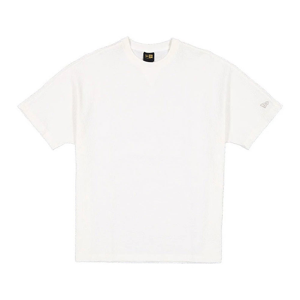 The model is wearing this New Era Black Label Seersucker T-Shirt in Cream. 1