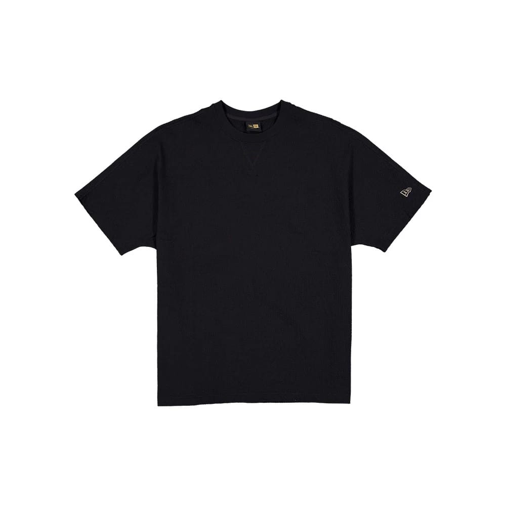 New Era Black Label Seersucker Black T-Shirt, front view showing a simple black design with short sleeves, a V-stitch detail beneath the collar, and a small debossed New Era logo on the left sleeve near the hem.