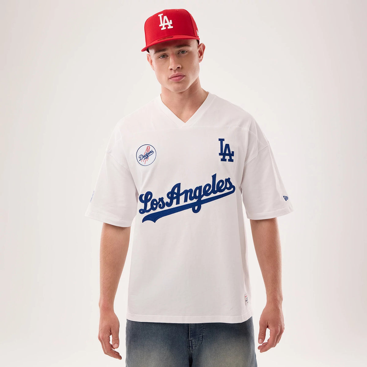 The model is wearing this MLB Fan Family Los Angeles Dodgers Jersey in white. 1
