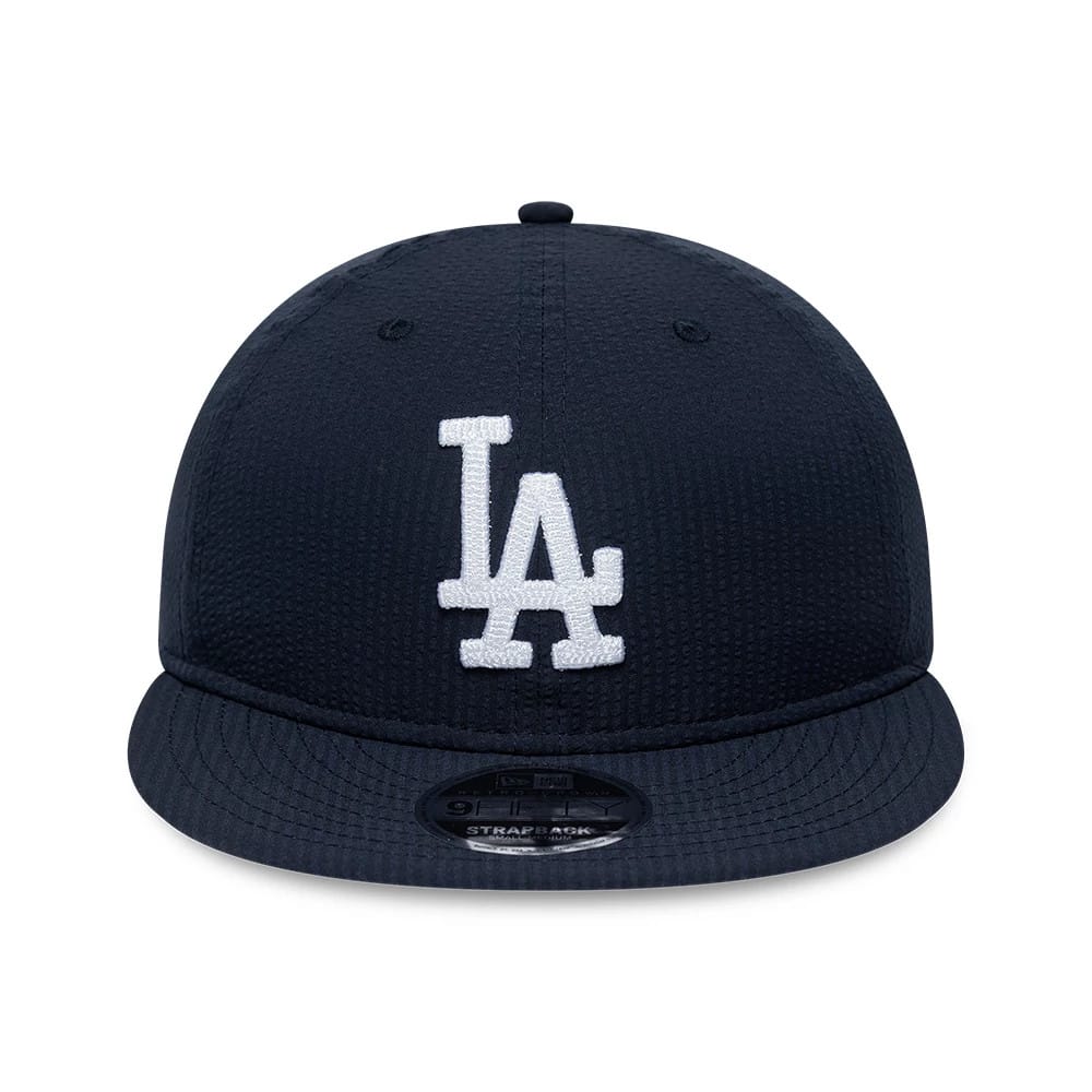 LA Dodgers MLB Seersucker Navy Retro Crown New Era 9FIFTY Adjustable Cap, front view showing a white LA logo in raised embroidery on the centre of the structured navy crown, with a 9FIFTY size sticker on the visor.