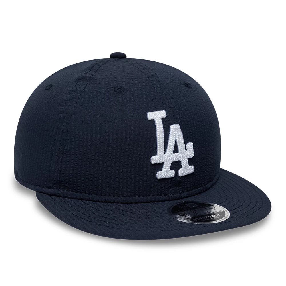 LA Dodgers MLB Seersucker Navy Retro Crown New Era 9FIFTY Adjustable Cap, front view showing the raised white embroidered LA logo on the front panel, with a flat navy visor and a 9FIFTY size sticker on top.