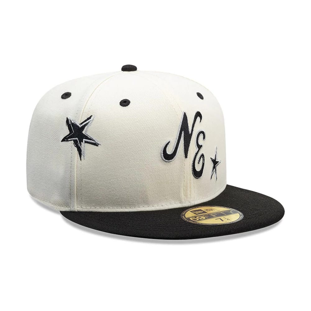 New Era Punkcore White & Black 59FIFTY Fitted Cap, three-quarter view with black-and-white embroidered NE lettering and star designs on the front panel, black visor, and gold 59FIFTY size sticker on the visor.