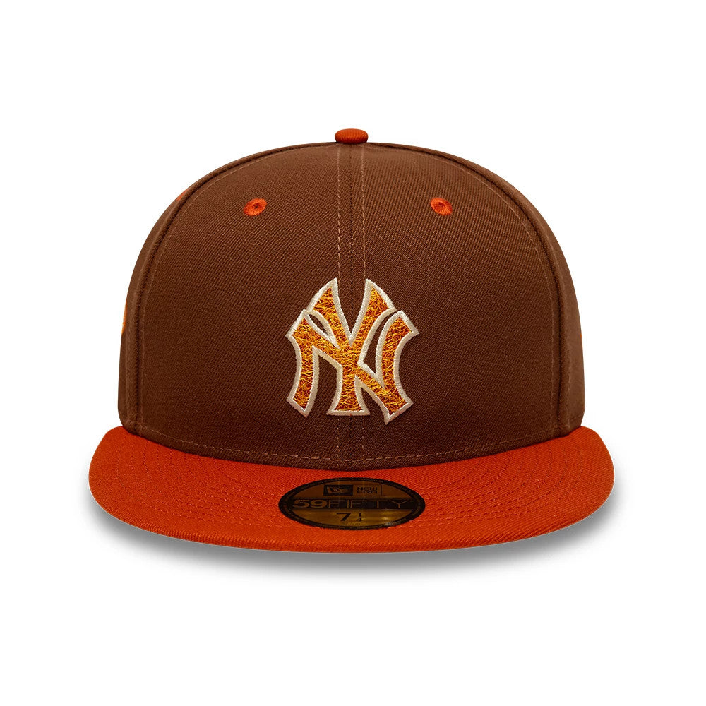 New York Yankees MLB Pack Brown New Era 59FIFTY Fitted Cap, front view with raised orange and white Yankees logo on the brown front panel, contrasting orange visor and top button, with a gold 59FIFTY size sticker on the visor.