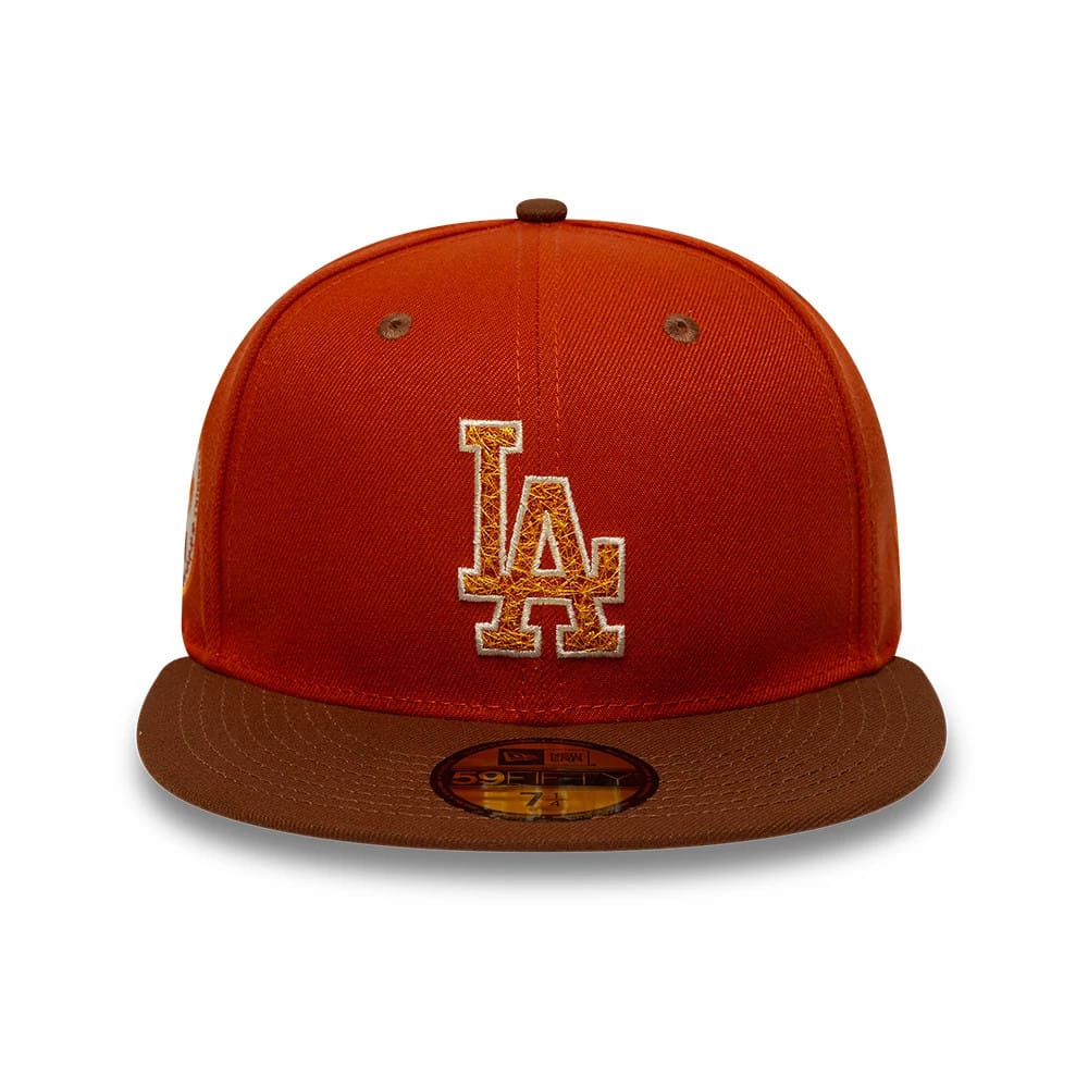 Los Angeles Dodgers MLB Pack Dark Orange New Era 59FIFTY Fitted Cap, front view showing the raised LA logo in white and orange embroidery on the crown, with a brown flat visor and a gold 59FIFTY size sticker.