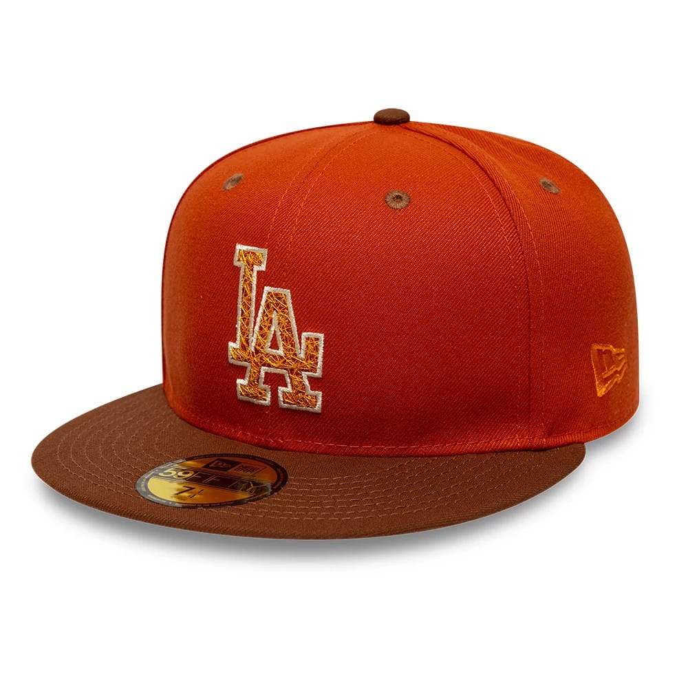 Los Angeles Dodgers MLB Pack Dark Orange New Era 59FIFTY Fitted Cap, three-quarter view showing the embroidered LA logo on the front panel, brown visor with a gold 59FIFTY size sticker, and New Era flag logo on the left side.