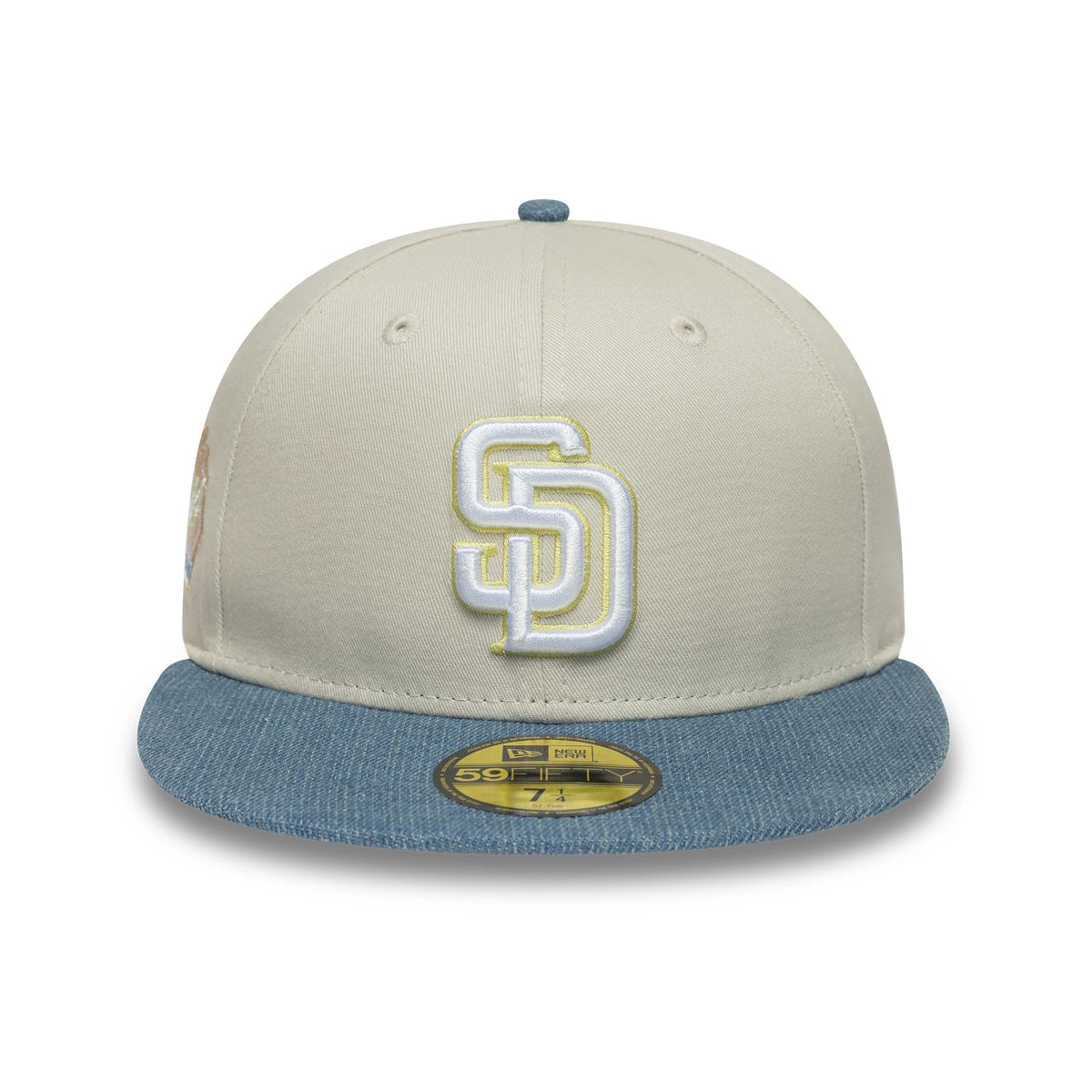 San Diego Padres MLB Denim Mix Beige New Era 59FIFTY Fitted Cap, front view showing a raised white SD logo with yellow outlining on the front panel, contrasted by a denim blue flat visor with a gold 59FIFTY size sticker.