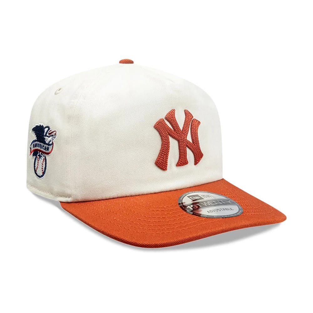 New York Yankees MLB Pack Cream & Orange New Era 19TWENTY Adjustable Cap, three-quarter view showing orange NY logo on front panel, matching top button and visor with a 19TWENTY size sticker, and side American League logo.