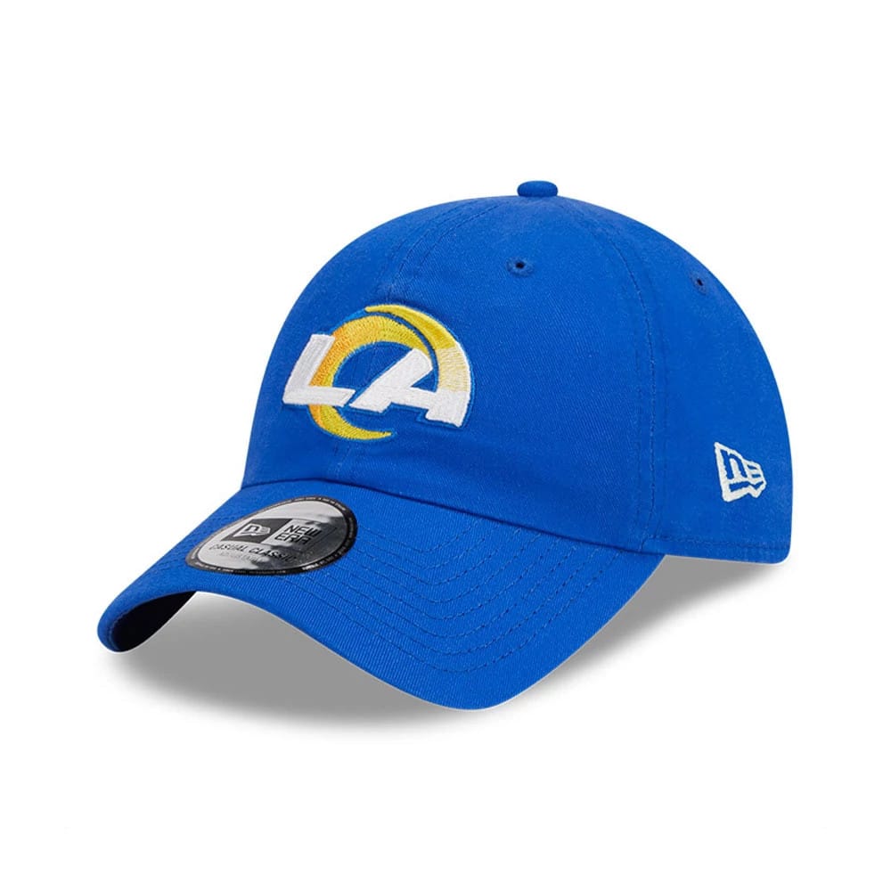 LA Rams NFL X Bad Bunny Bright Blue New Era Casual Classic Adjustable Cap, front view showing white and yellow embroidered LA logo on the blue front panel, black 9FORTY size sticker on the curved visor, and New Era flag logo on the left side.
