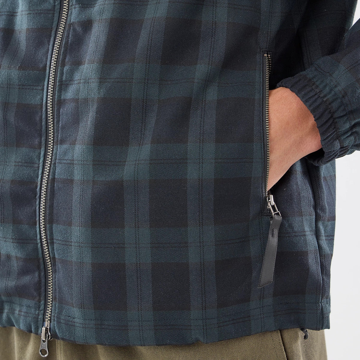 The model is wearing this New Era Blouson Plaid Windbreaker Jacket in Navy. 4