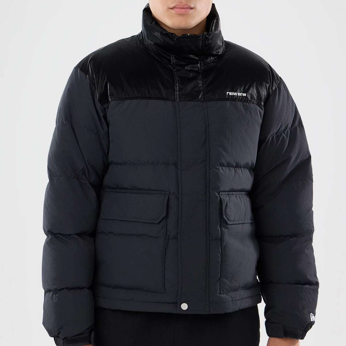 The model is wearing this New Era Down Jacket in black. 3