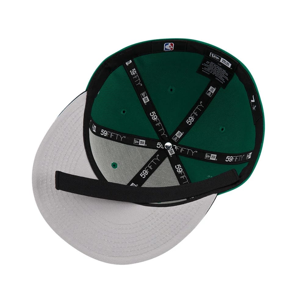 New Era Black Cap Liner, inside view showing the black taping with white 59FIFTY branding across a green interior crown, grey undervisor, and black sweatband, with the MLB logo on the taping.