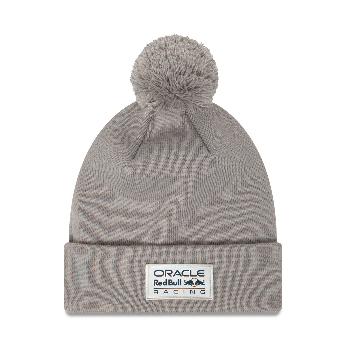 Red Bull Team Grey Bobble Knit Grey Beanie Hat, front view showing a large bobble on top and an embroidered Oracle Red Bull Racing patch on the cuff, centred on the grey knit crown.