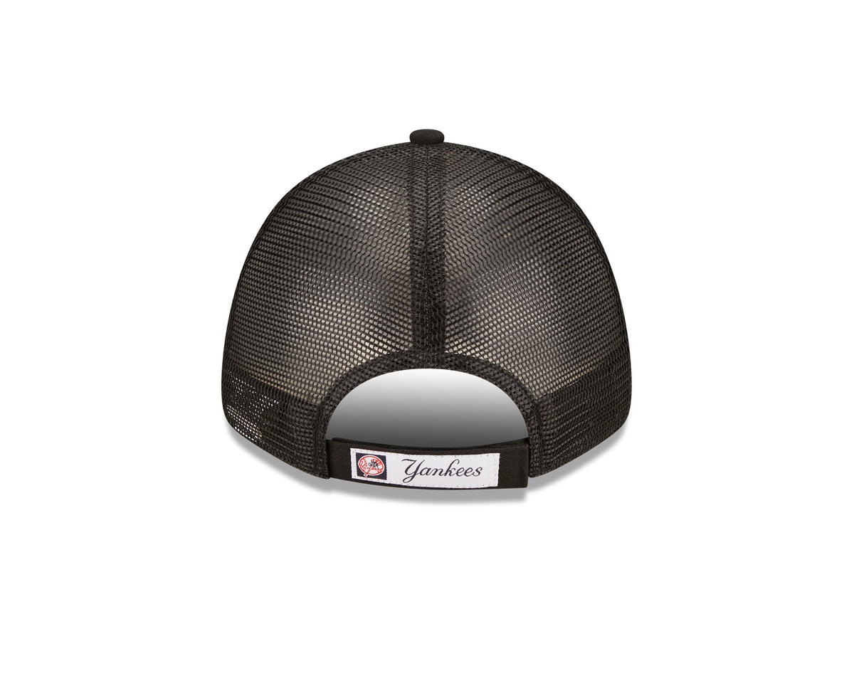 New York Yankees Home Field Black New Era 9FORTY A-Frame Trucker Cap, rear view showing the Yankees script on the adjustable strap above a curved opening, with mesh panels and a black top button on the crown.