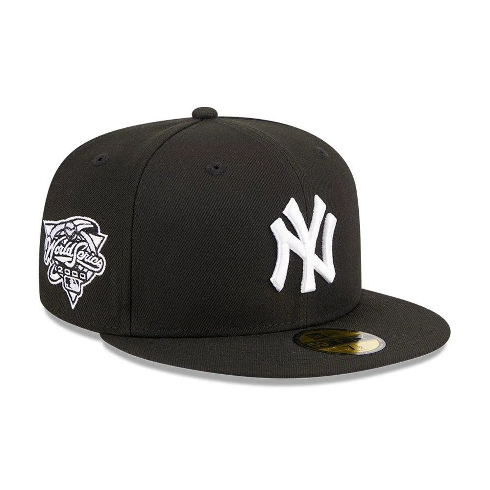 New York Yankees MLB Evergreen Black New Era 59FIFTY Fitted Cap, three-quarter view showing the raised white embroidered NY logo on the front panel, a World Series patch on the left side, and the gold 59FIFTY size sticker on the flat visor.
