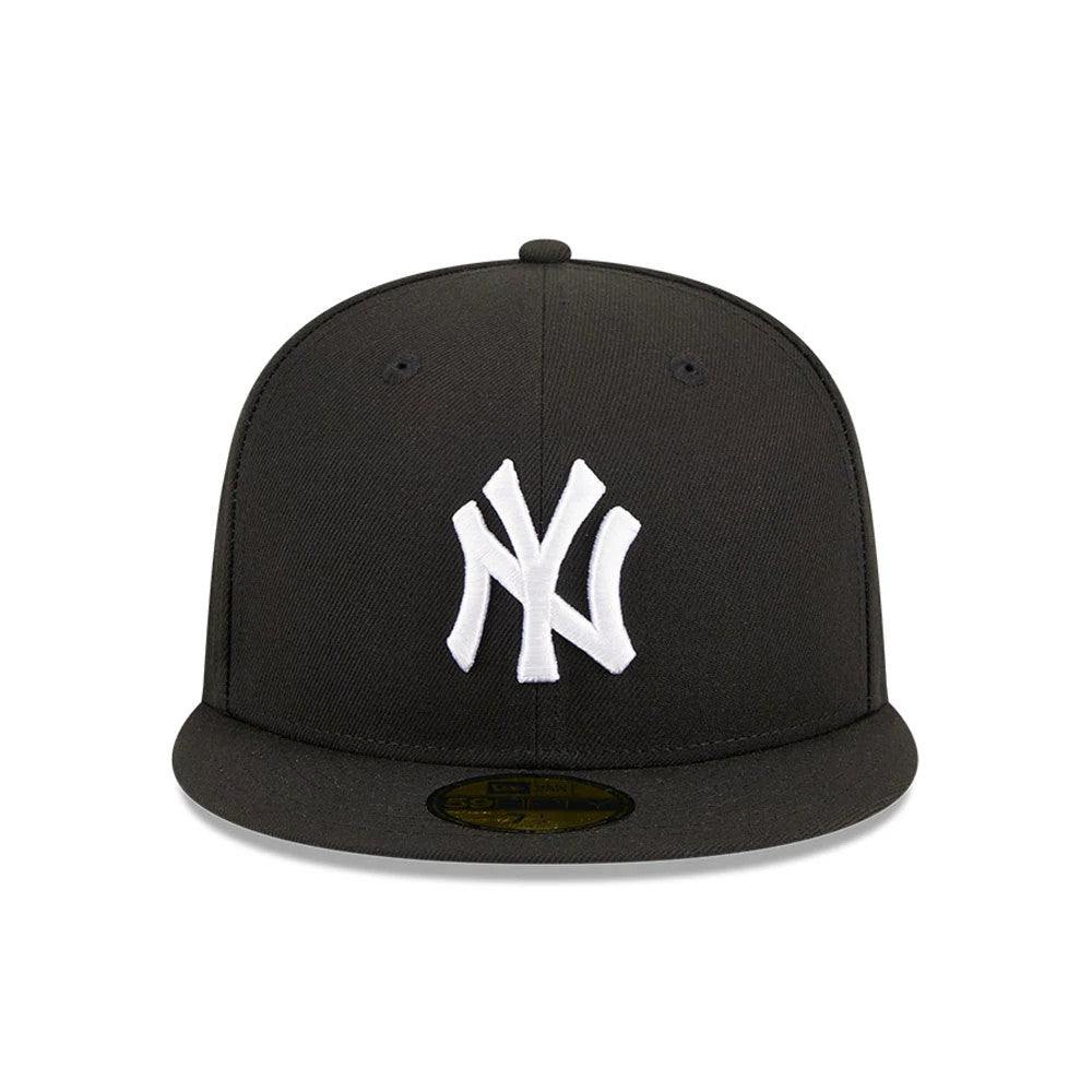 New York Yankees MLB Evergreen Black New Era 59FIFTY Fitted Cap, front view showing the prominently raised white embroidered NY logo on the black front panel, with a gold 59FIFTY size sticker on the flat visor.