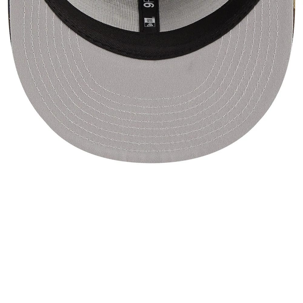 Atlanta Braves MLB Evergreen Camo New Era 9FIFTY Trucker Adjustable Cap, inside view showing black taping with New Era and size details on the grey undervisor and a curved black sweatband.