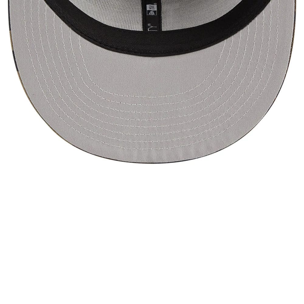 LA Dodgers MLB Evergreen Camo New Era 9FIFTY Trucker Adjustable Cap, inside view showing black taping with white branding on the grey undervisor, complemented by intricate white stitching around the edge.