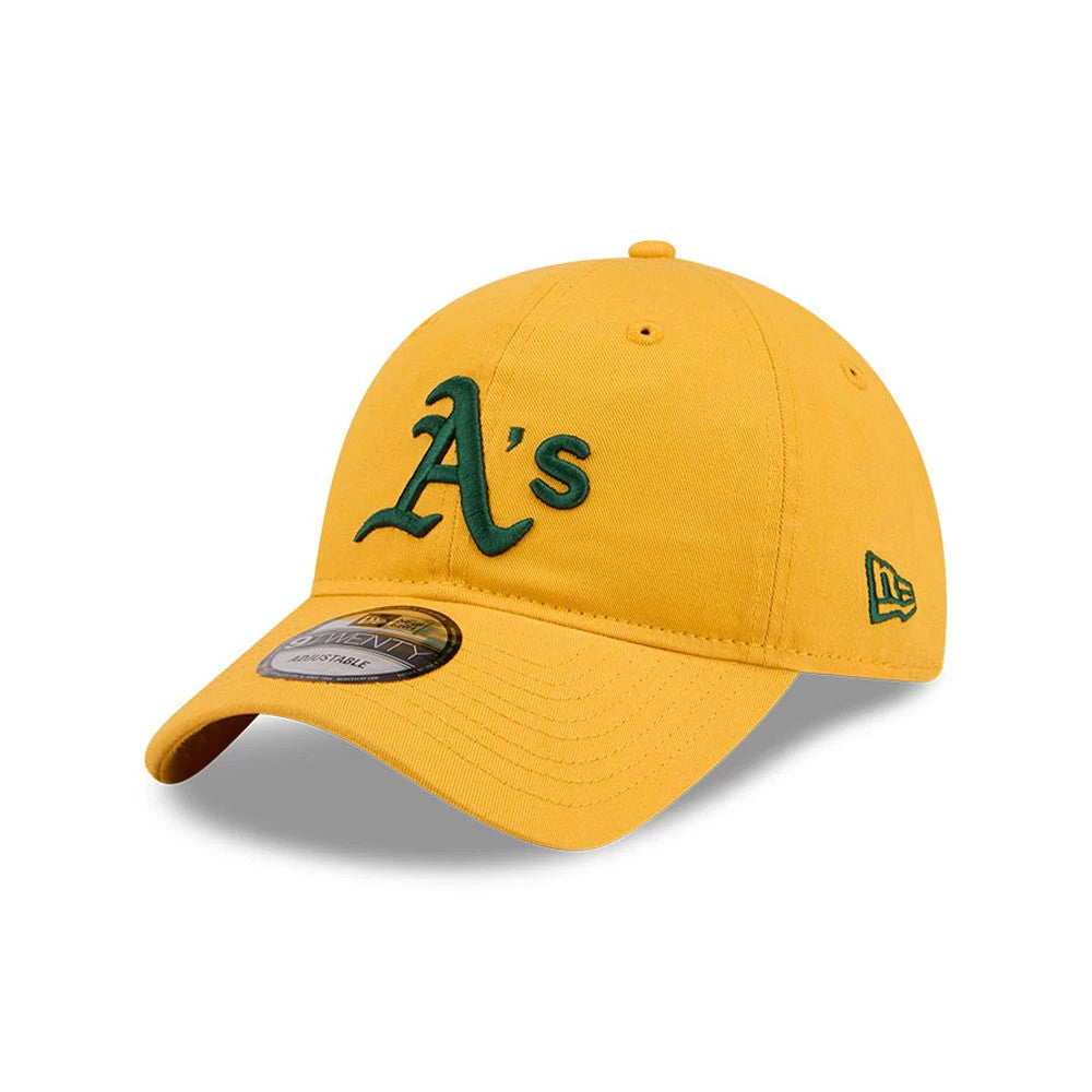 Athletics MLB Evergreen Dark Yellow New Era 9TWENTY Adjustable Cap, front view with a green embroidered A's logo on the structured crown, matching New Era flag logo on the left side, and 9TWENTY size sticker on the visor.
