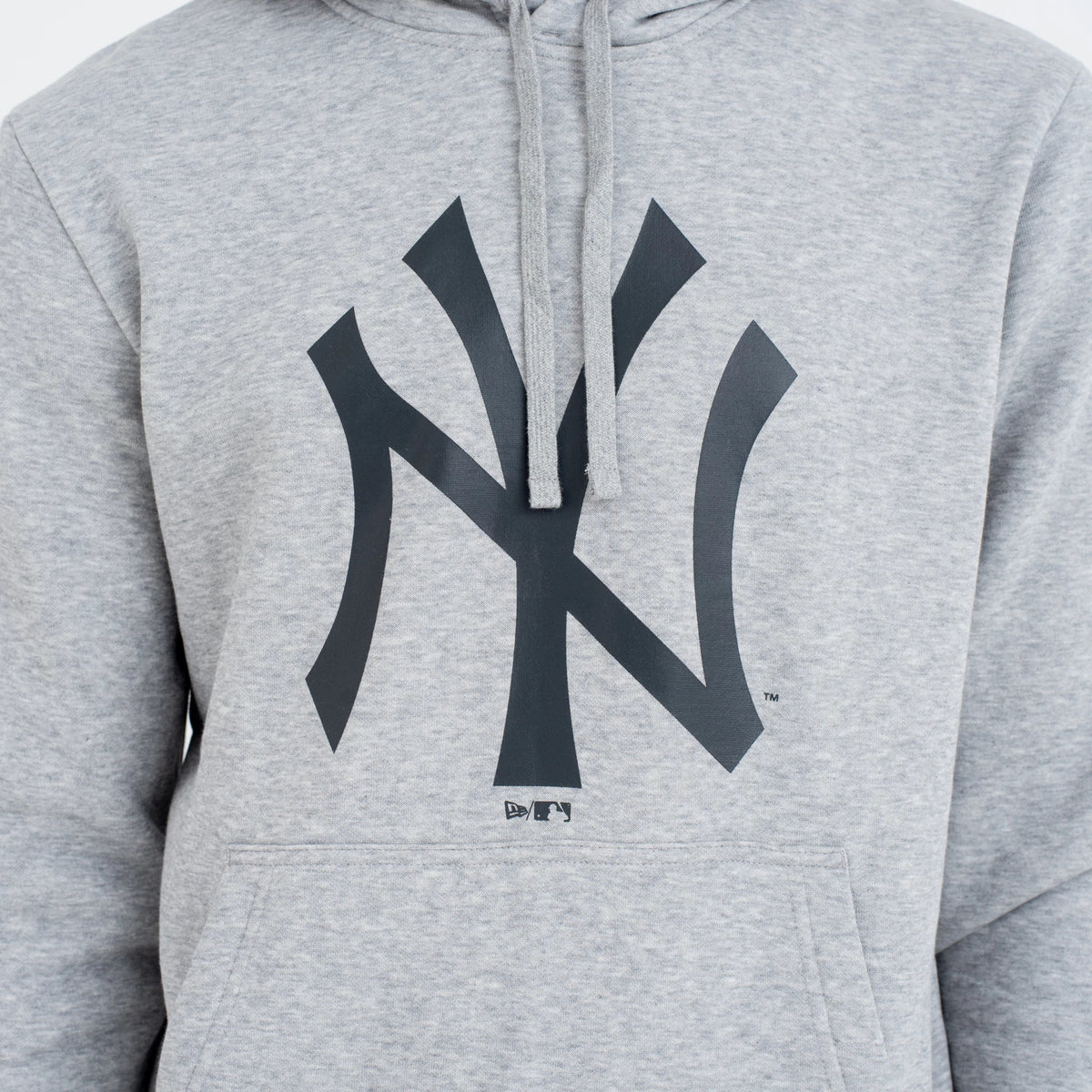 New York Yankees MLB Regular Grey Pullover Hoodie, front view showing the large raised black New York Yankees logo centred on the chest of the light grey hoodie with drawstrings hanging from the hoodie collar.