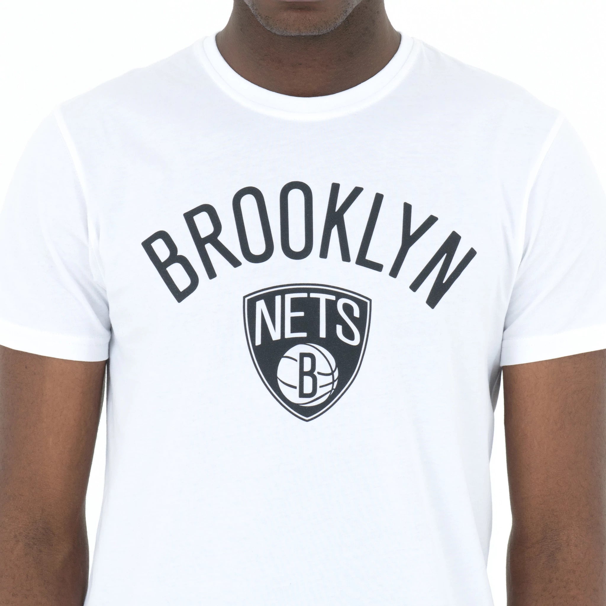 Brooklyn Nets NBA Regular White T-Shirt, front view showing the bold black Brooklyn Nets logo and text centrally printed across the chest on a plain white shirt with short sleeves and a round neckline.