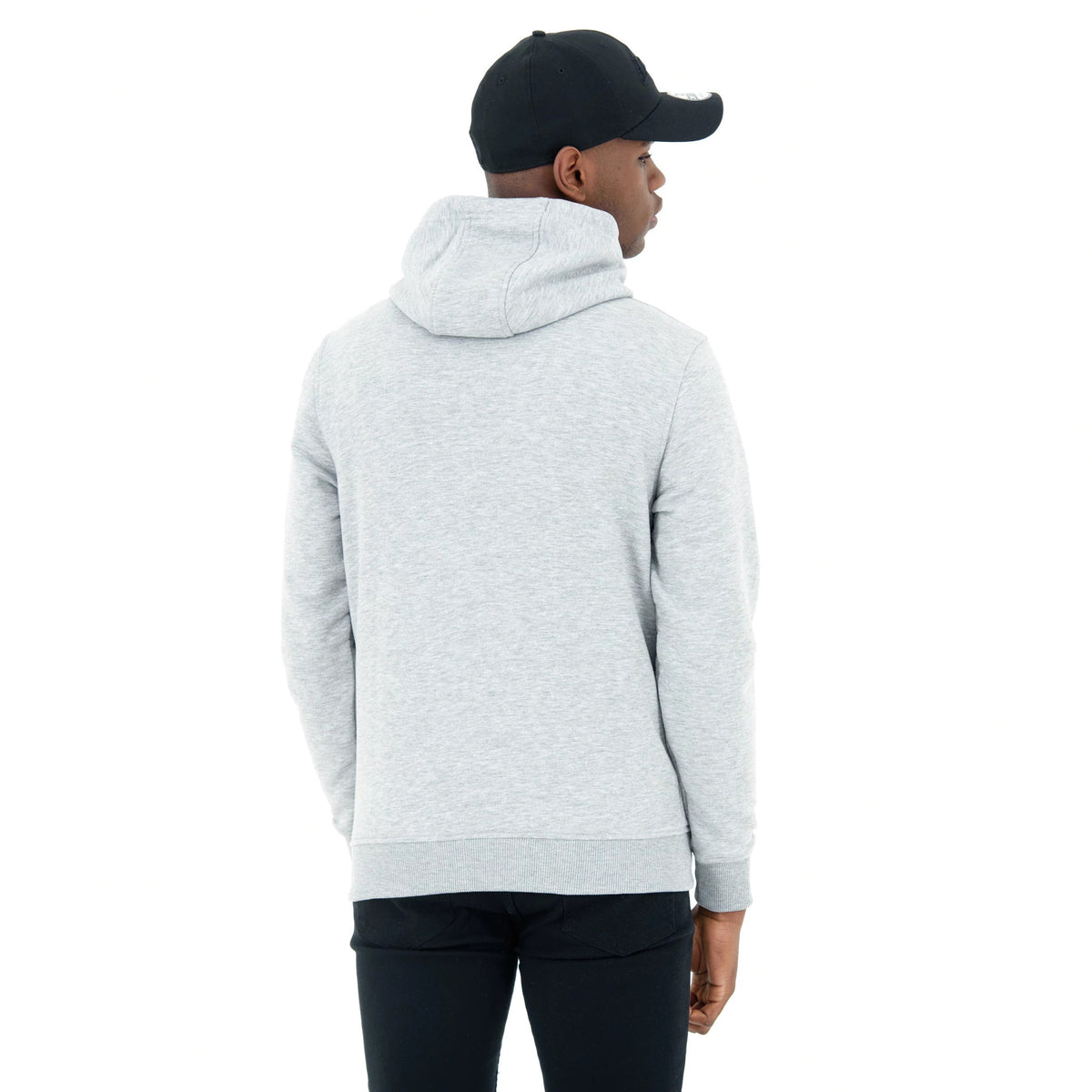 LA Lakers NBA Regular Grey Pullover Hoodie, rear view showing the light grey colour with a spacious hood, the hem and cuffs in a matching ribbed trim, worn by a model in black trousers and a black cap.