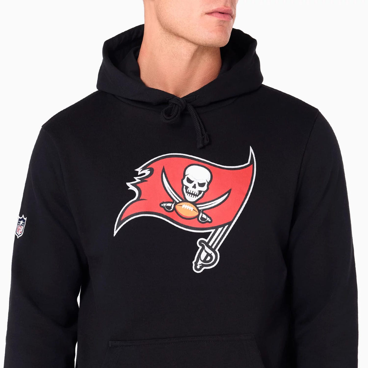 New Era Tampa Bay Buccaneers NFL Black Pullover Hoodie, front view showing a large red flag with a skull and crossed swords printed on the chest, a drawstring hood, and a small embroidered logo on the sleeve.