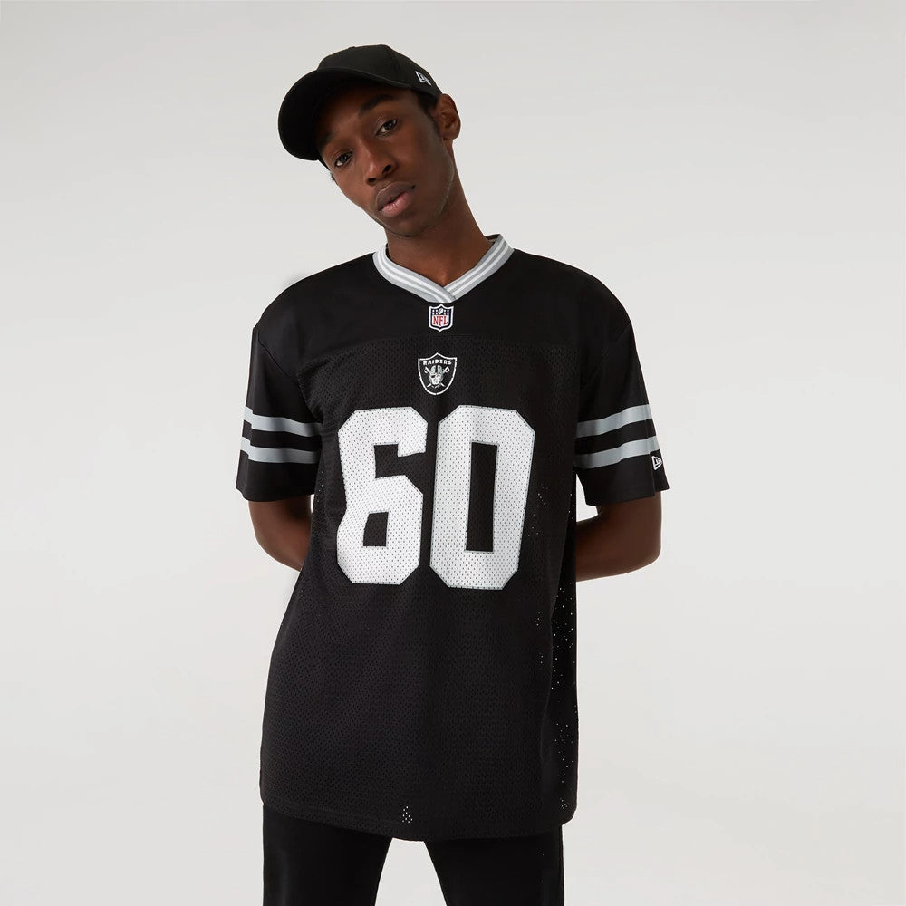 Las Vegas Raiders NFL Black Mesh T-Shirt, on-model view showing the black mesh fabric with a white "60" on the front, a debossed Raiders logo above it, grey and white stripes on the sleeves and a debossed New Era logo on the left sleeve.