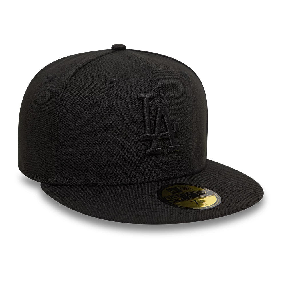 LA Dodgers League Essential Black New Era 59FIFTY Fitted Cap, front view with raised black embroidered LA logo on the front panel, a flat black visor, black top button, and a gold 59FIFTY size sticker on the visor.
