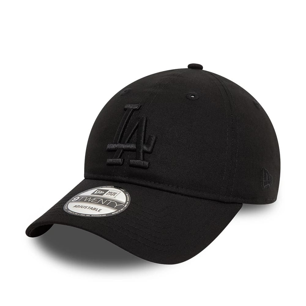 LA Dodgers League Essential Black New Era 9TWENTY Adjustable Cap, three-quarter view showing the raised black embroidered LA logo on the front panel, curved visor with 9TWENTY size sticker, and New Era flag logo on the left side.