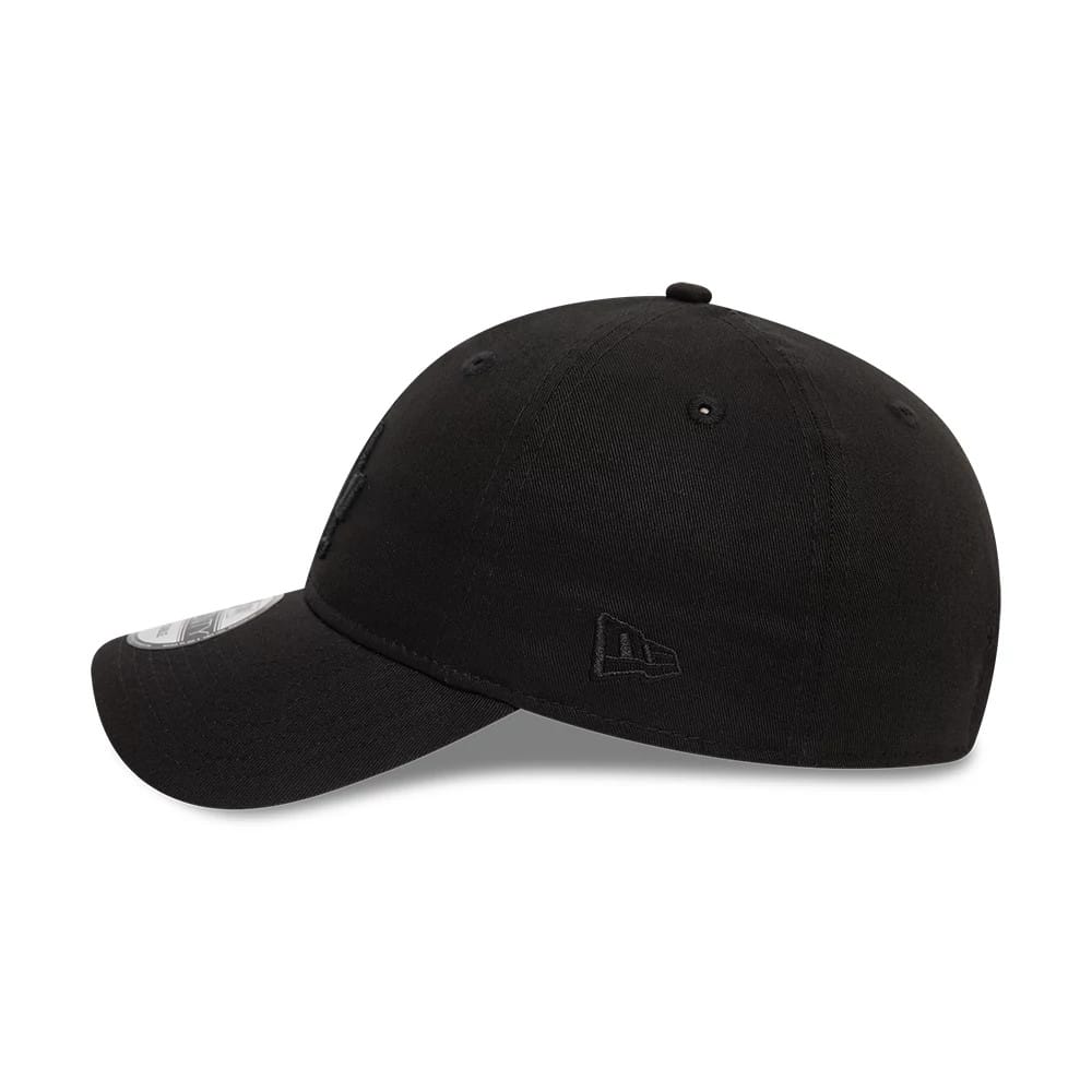LA Dodgers League Essential Black New Era 9TWENTY Adjustable Cap, side view showing the tonal New Era flag logo embroidered on the left side, with a curved visor and 9TWENTY size sticker on the edge.