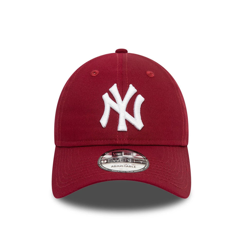 New York Yankees League Essential Dark Red New Era 9TWENTY Adjustable Cap, front view showing the white raised embroidered NY logo on the front panel, with matching eyelets and a 9TWENTY size sticker on the curved visor.