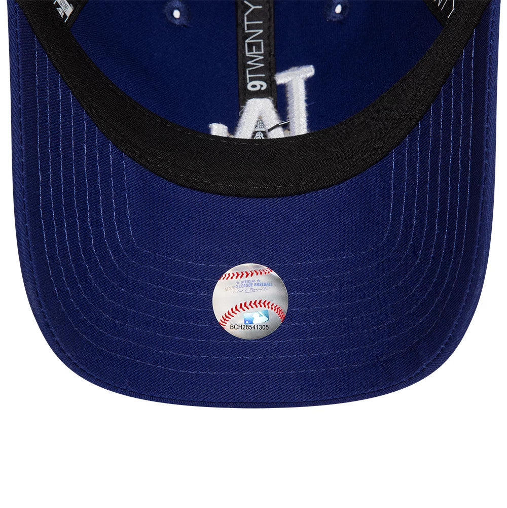LA Dodgers League Essential Dark Blue New Era 9TWENTY Adjustable Cap, inside view showing the black sweatband, 9TWENTY taping, white LA logo embroidery on blue fabric, and a round authenticity sticker on the dark blue undervisor.