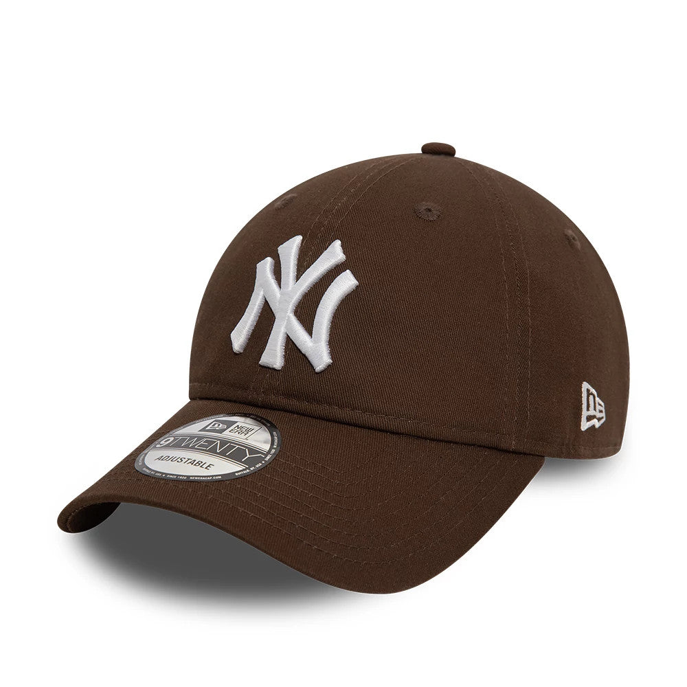 New York Yankees League Essential Dark Brown New Era 9TWENTY Adjustable Cap, front view with a white raised embroidered NY logo on the front panel, a curved visor with a 9TWENTY size sticker, and the New Era flag logo on the left side.