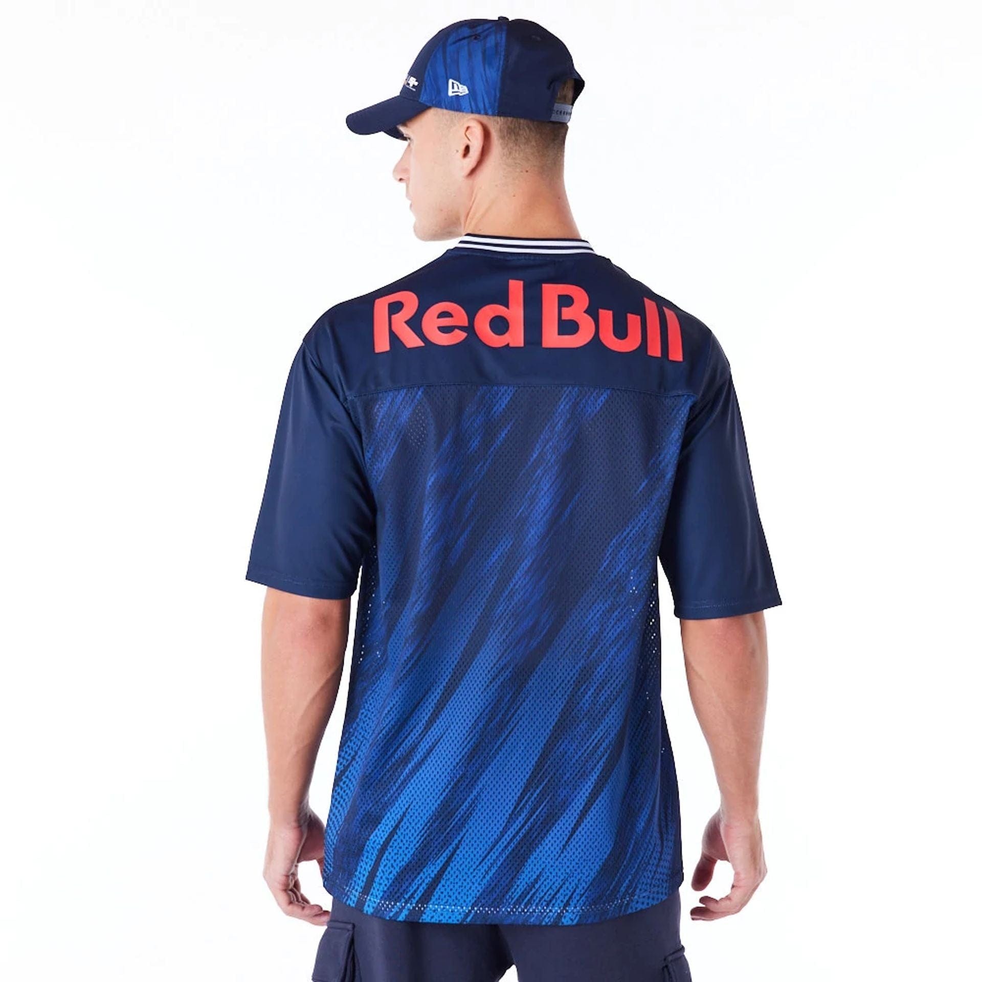 The Male model is wearing Red Bull Sim Racing Navy V Neck Jersey 2