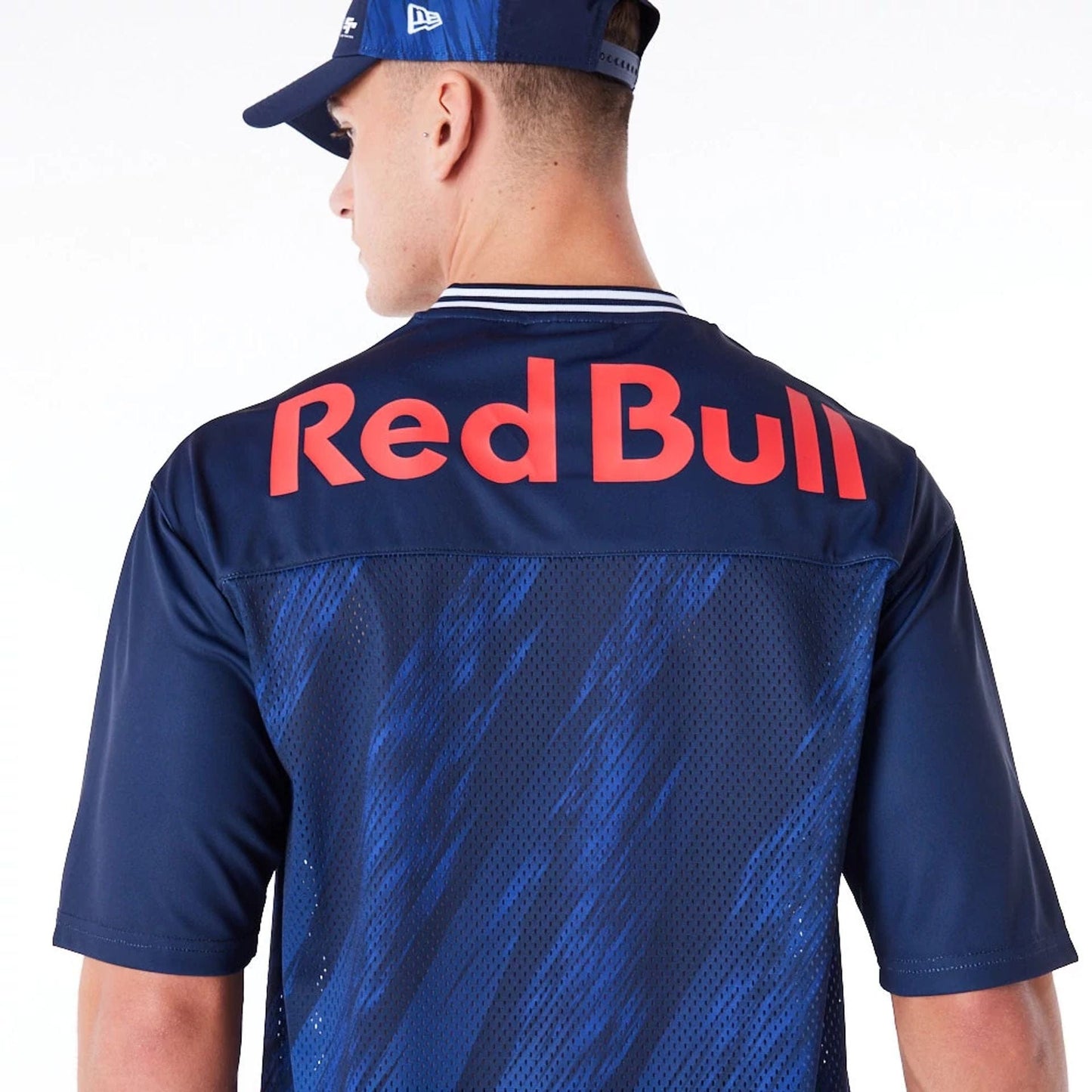 The Male model is wearing Red Bull Sim Racing Navy V Neck Jersey 8