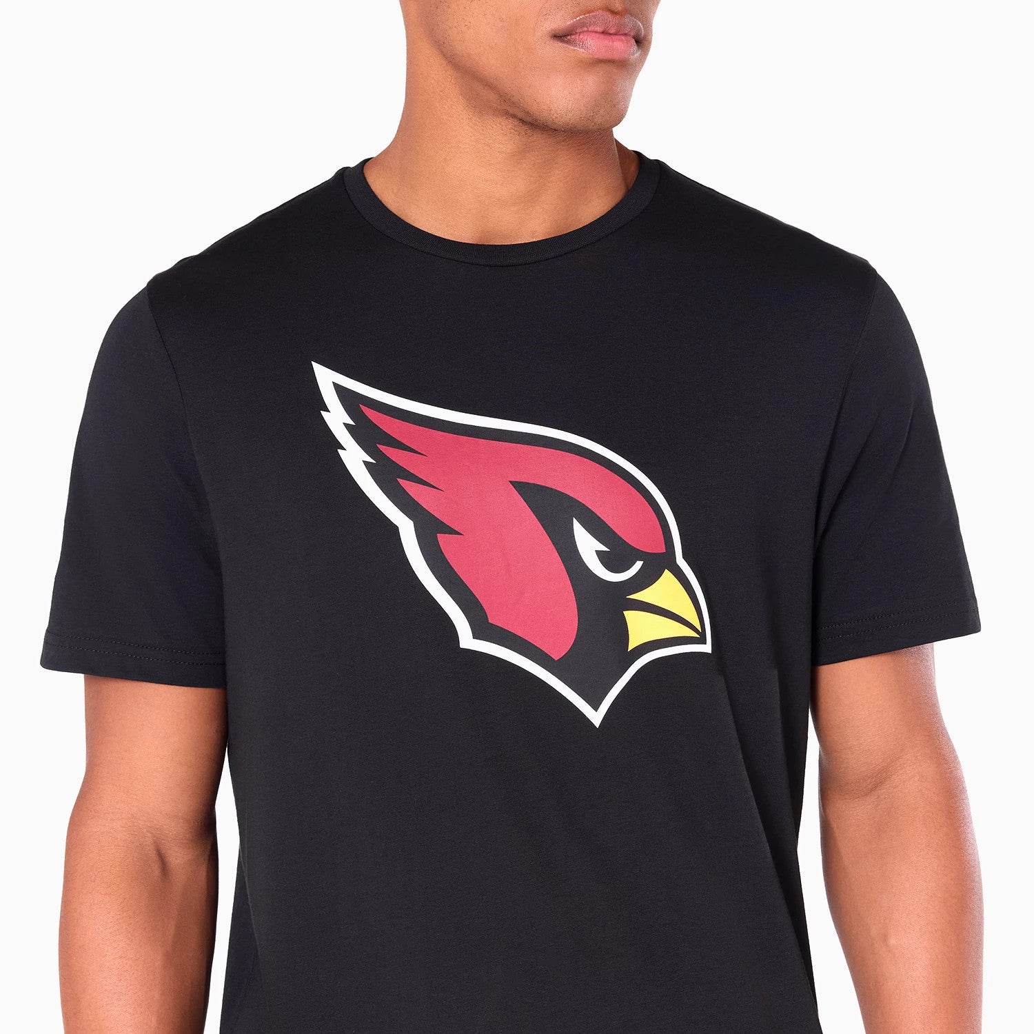 New Era Arizona Cardinals NFL Black T-Shirt, front view showing a large red and yellow Cardinal head logo printed on the chest of the black T-shirt with a round neckline and short sleeves.