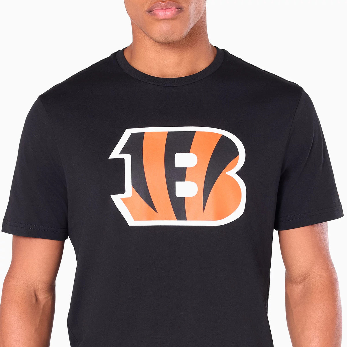 New Era Cincinnati Bengals NFL Black T-Shirt, front view showing a large orange and black B logo with tiger stripes centred on the chest, worn by a model, the sleeves and neckline blending seamlessly into the black fabric.