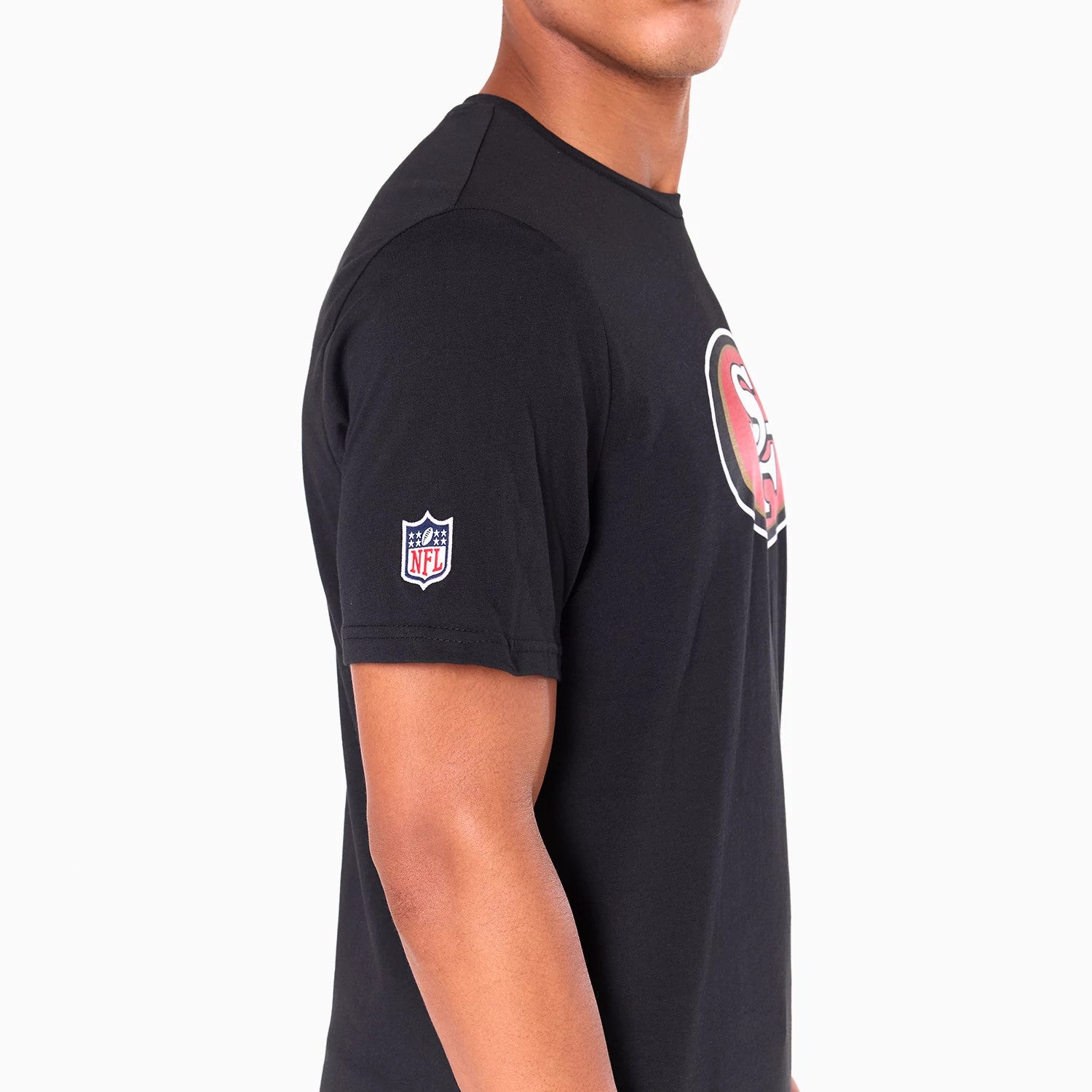 New Era San Francisco 49ers NFL Black T-Shirt, side view showing the black fabric with a printed NFL logo on the sleeve and part of the large San Francisco 49ers logo on the chest.