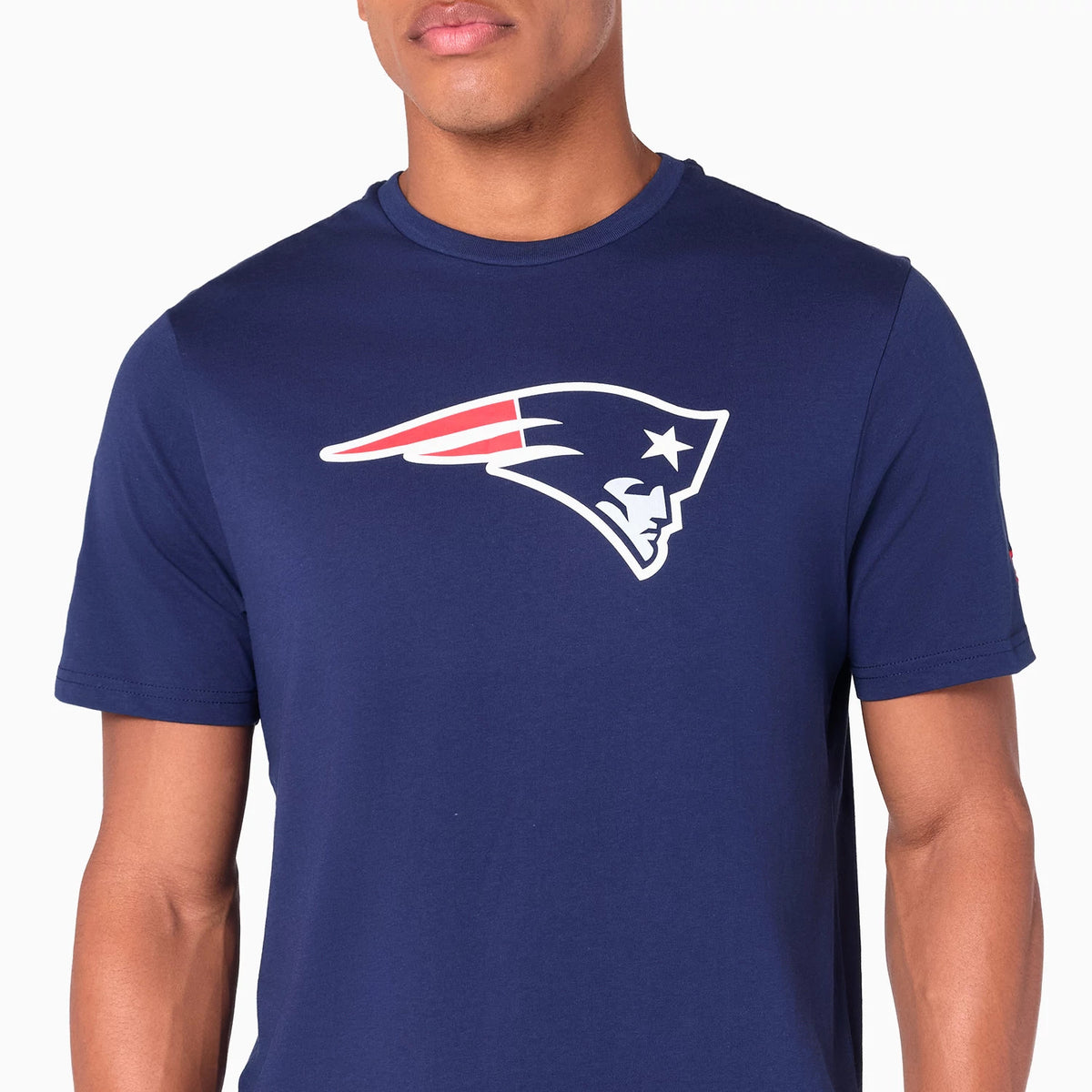 New Era New England Patriots NFL Navy T-Shirt, on-model view showing the large Patriots logo printed in white, red, and blue on the chest, against the navy fabric, short sleeves, and a round neckline.