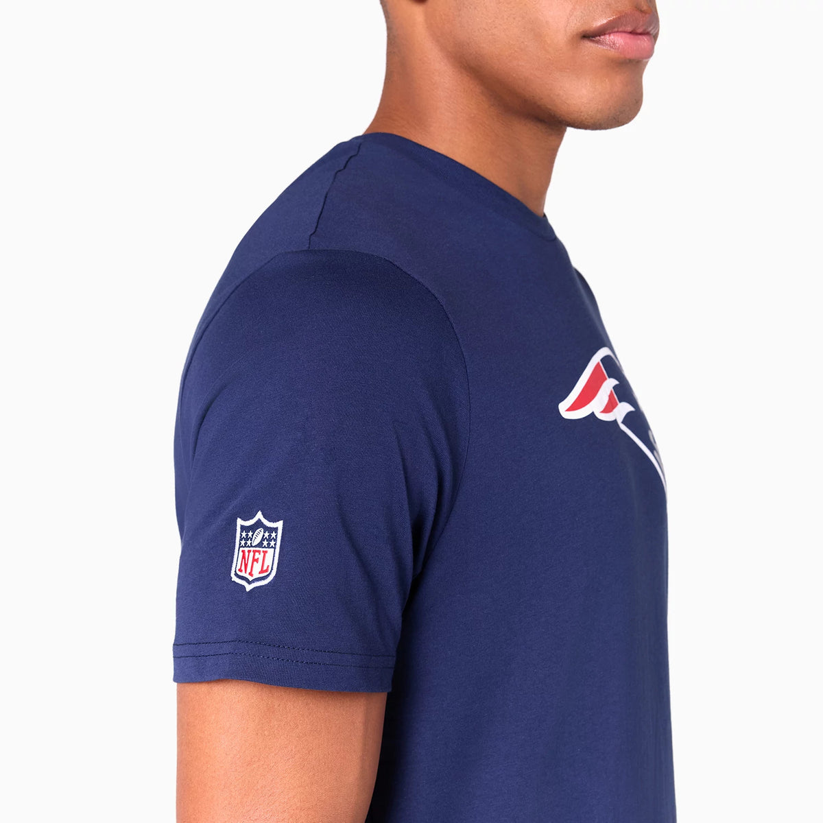 New Era New England Patriots NFL Navy T-Shirt, side view showing the navy fabric with a white and red Patriots logo on the chest, and an embroidered NFL shield logo on the sleeve.