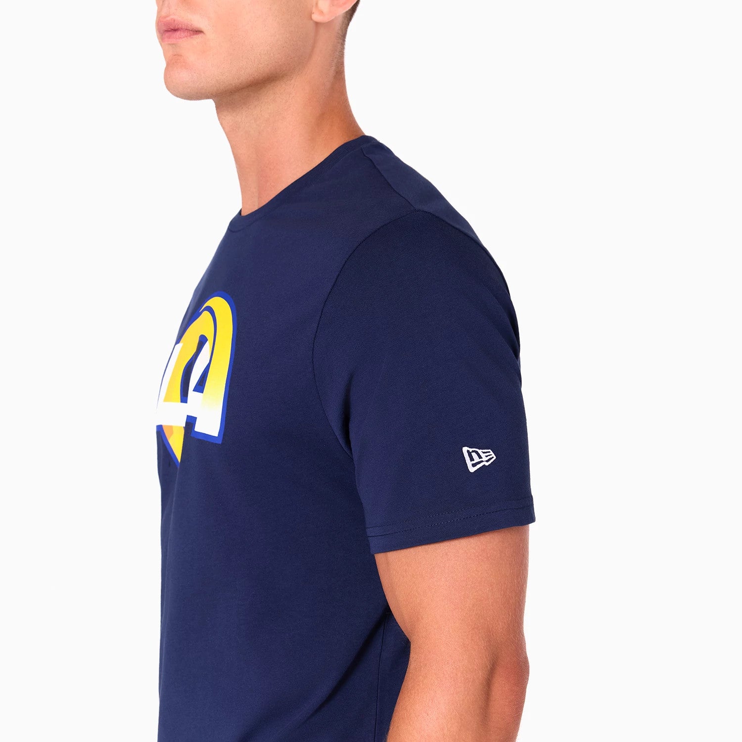 New Era LA Rams NFL Navy T-Shirt, side view showing a navy short-sleeved shirt with a large yellow and white LA Rams logo on the chest, and a white embroidered New Era logo on the sleeve.