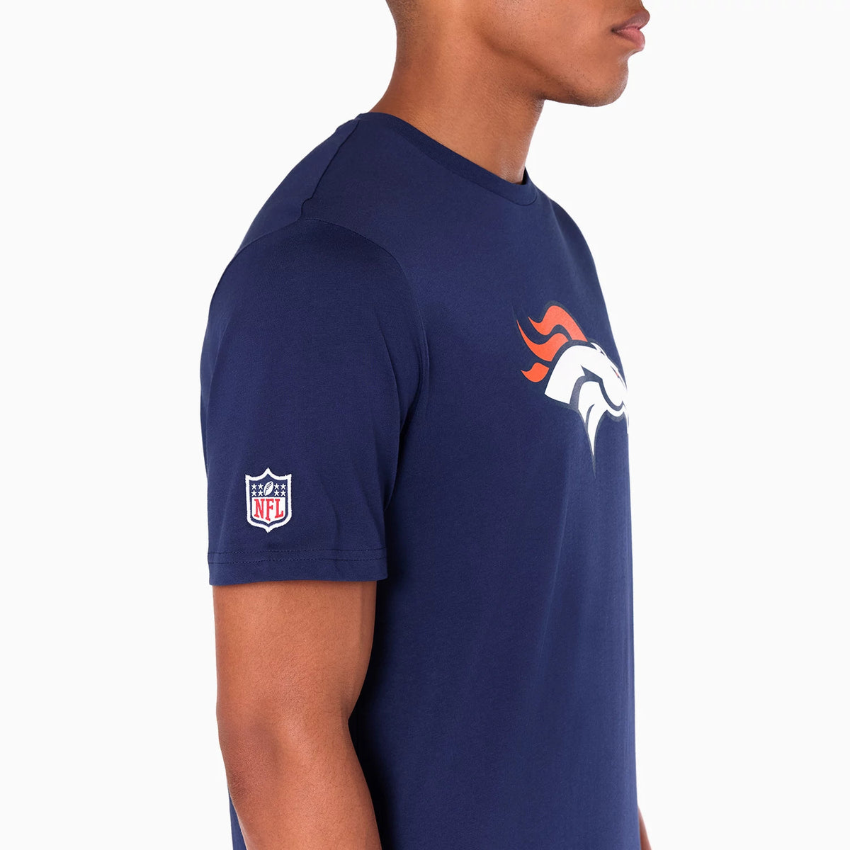 New Era Denver Broncos NFL Navy T-Shirt, side view showing the navy fabric with an orange and white raised Broncos logo on the chest and an NFL patch on the left sleeve near the shoulder.