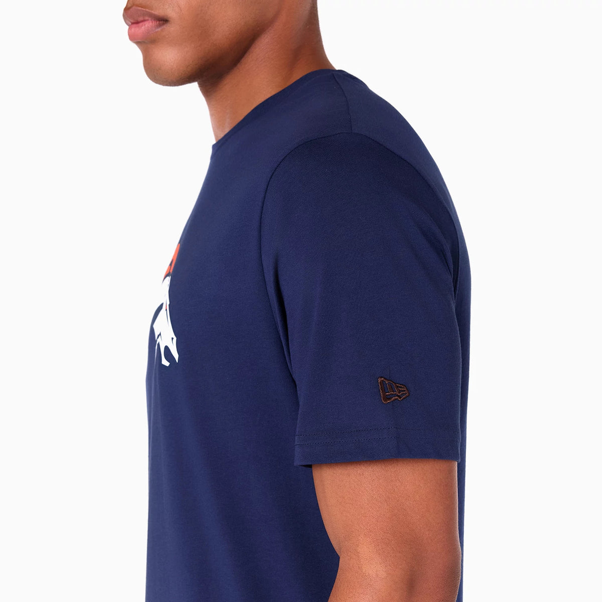 New Era Denver Broncos NFL Navy T-Shirt, side view showing a navy short sleeve with a raised New Era logo near the hem, and part of a large white and orange Denver Broncos logo across the chest.