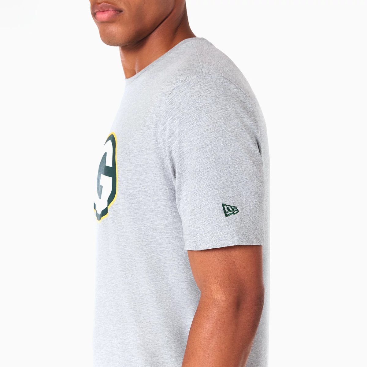 New Era Green Bay Packers NFL Grey T-Shirt, side view showing a grey short-sleeve shirt with a large Green Bay Packers logo on the chest and a small embossed New Era logo on the sleeve.