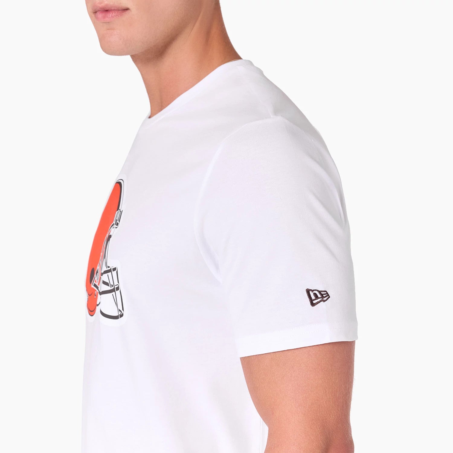 New Era Cleveland Browns NFL White T-Shirt, side view showing the large orange helmet graphic on the front, a raised New Era logo embroidered on the left sleeve, and a plain white background.