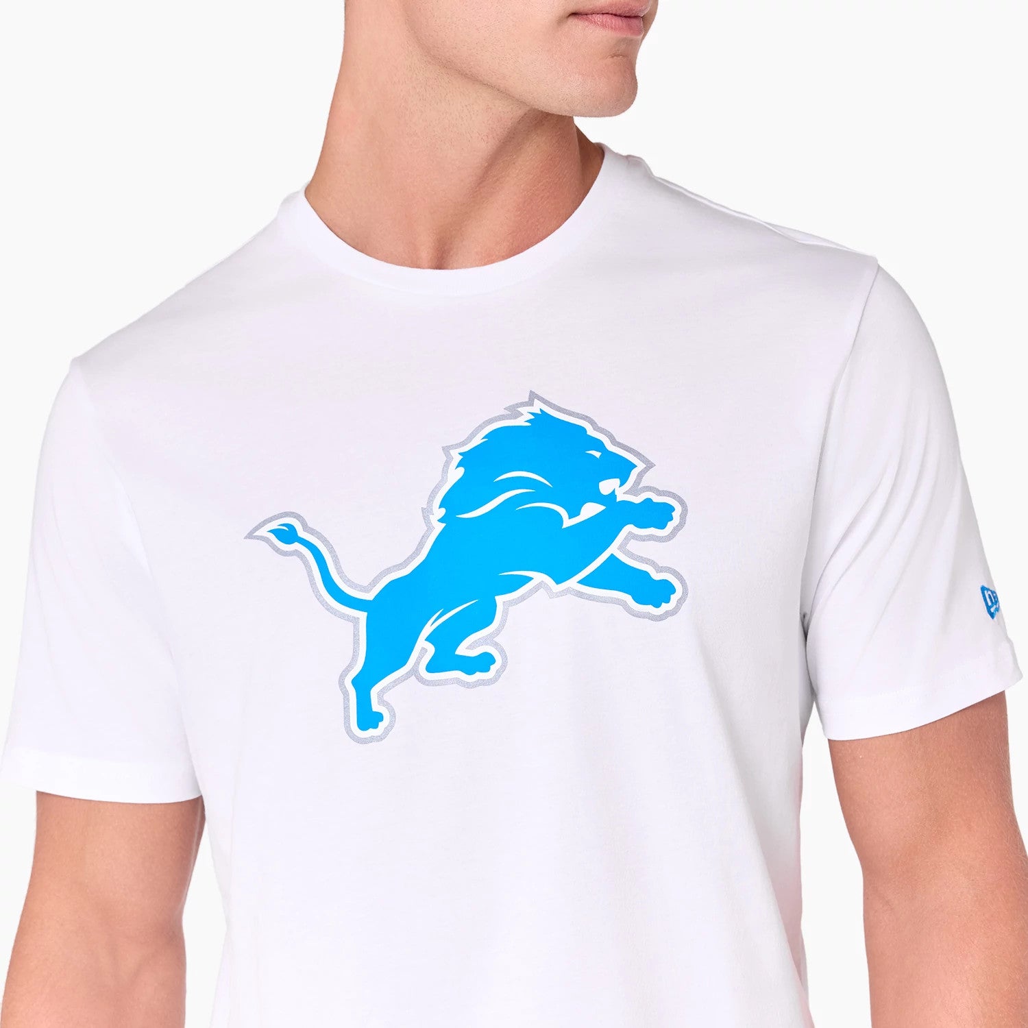 New Era Detroit Lions NFL White T-Shirt, front view showing the large blue lion logo printed in the centre of the white fabric, a small blue embroidered New Era logo on the left sleeve.