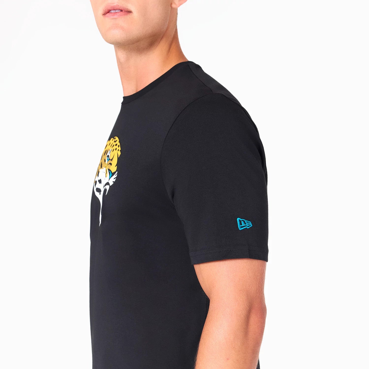 New Era Jacksonville Jaguars NFL Black T-Shirt, side view showing the black fabric with a raised blue New Era logo on the sleeve and the team logo featuring a jaguar head prominently displayed on the chest.